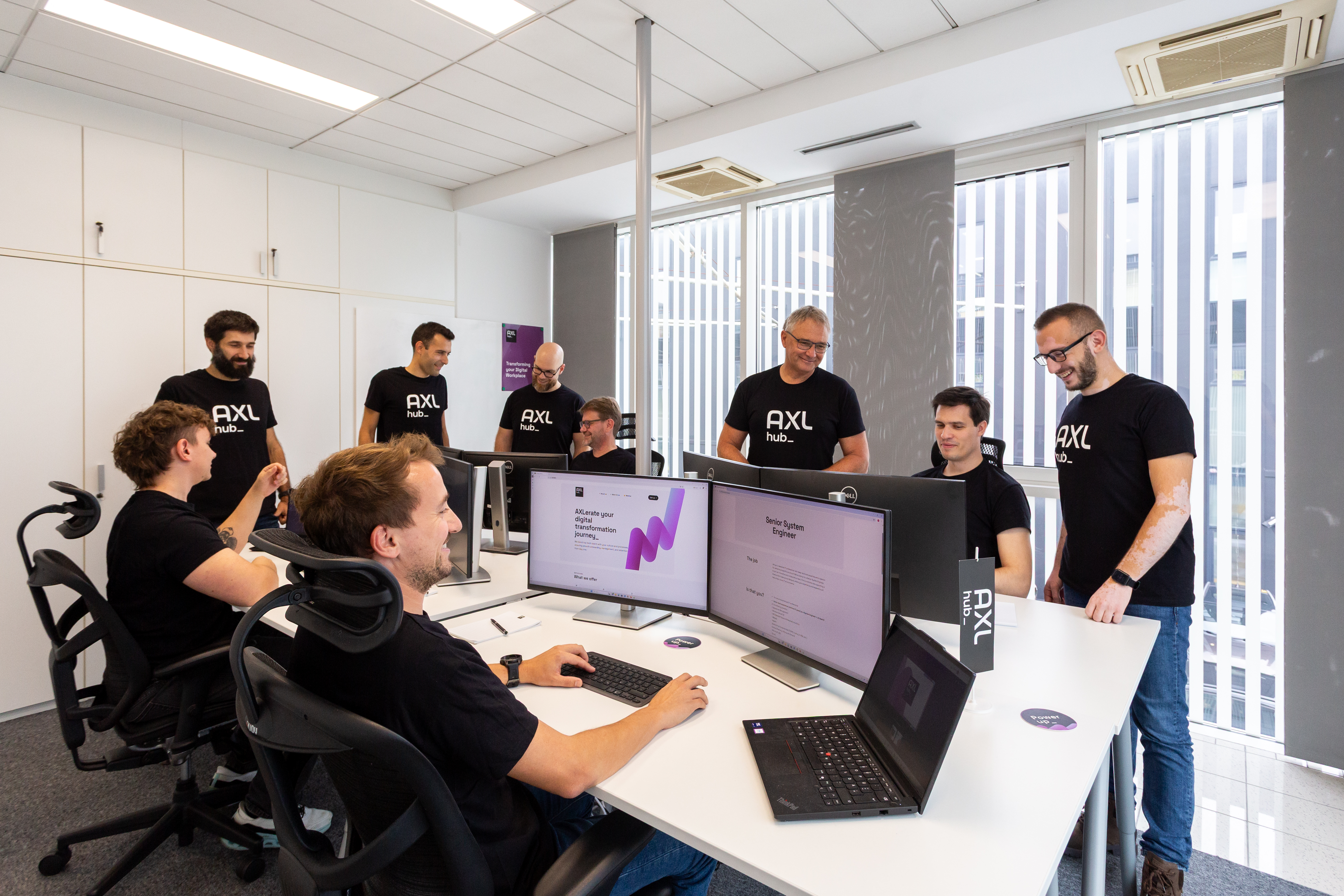 AXLhub team collaborating in the Ljubljana office